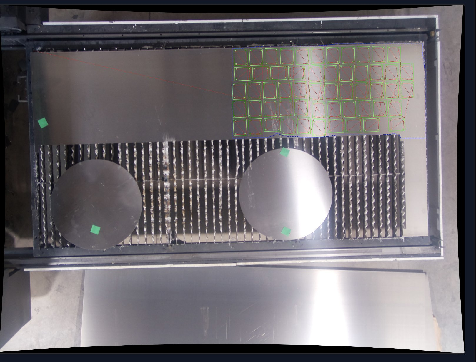 Camera nest: detected sheet boundary with parts nested inside it on the cutting bed