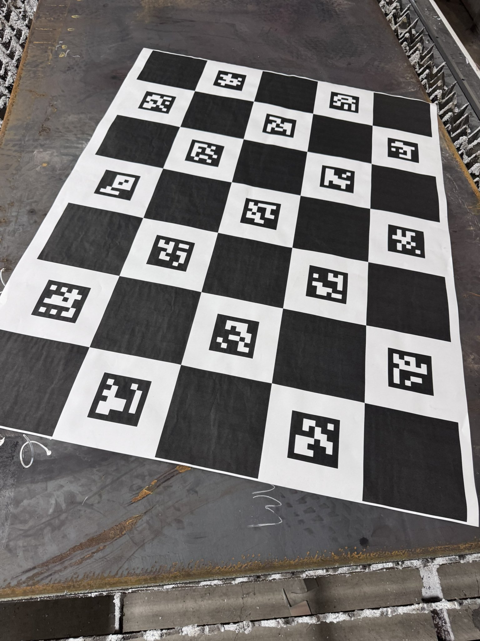 ChArUco calibration board laid on the cutting bed